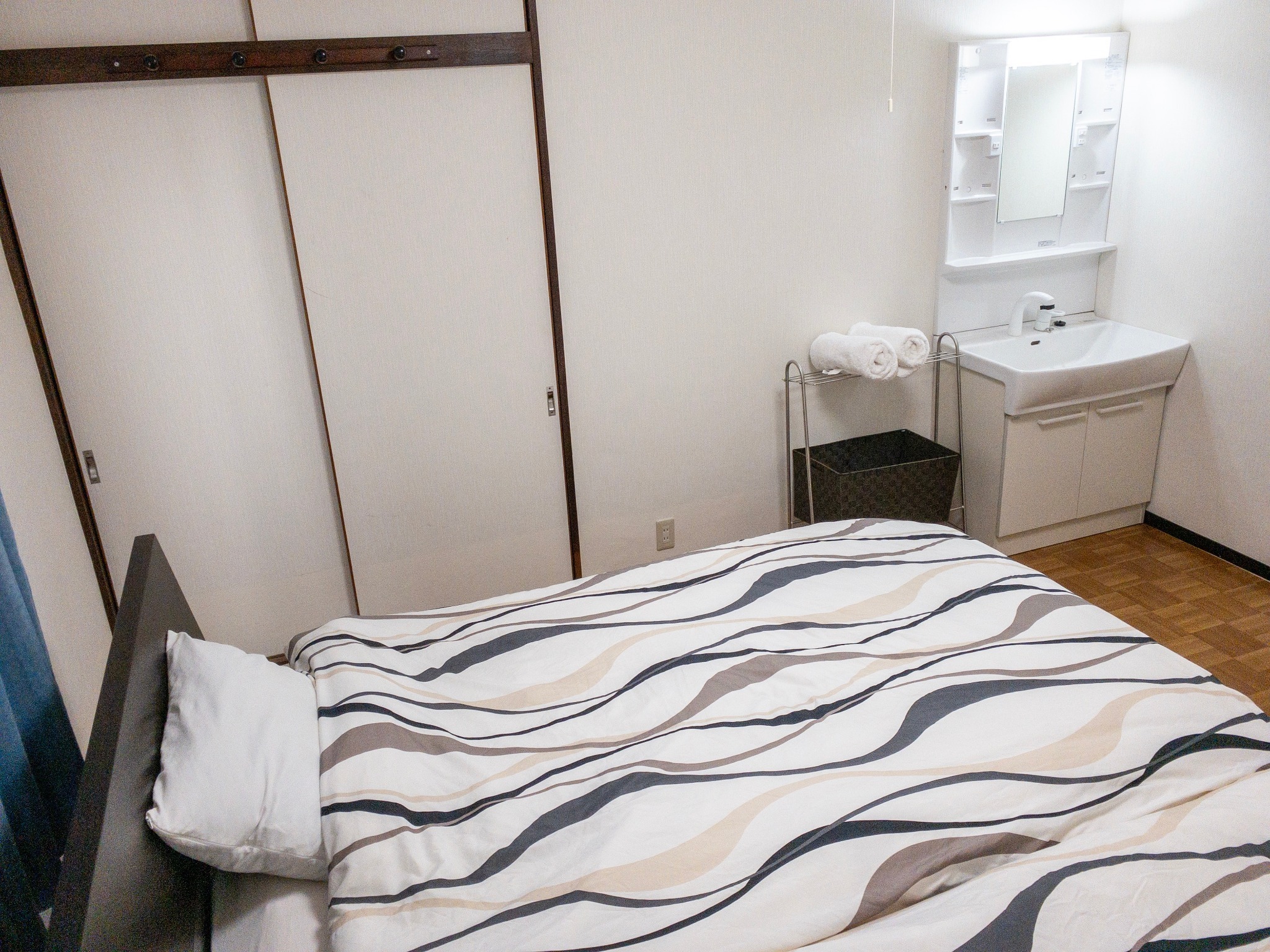 Bedroom #1:Two double beds with private washstand.